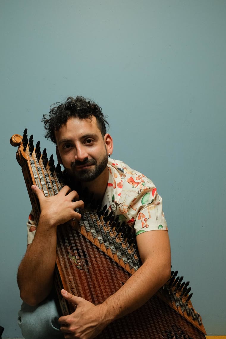 Camille El Feghali holding his qanun