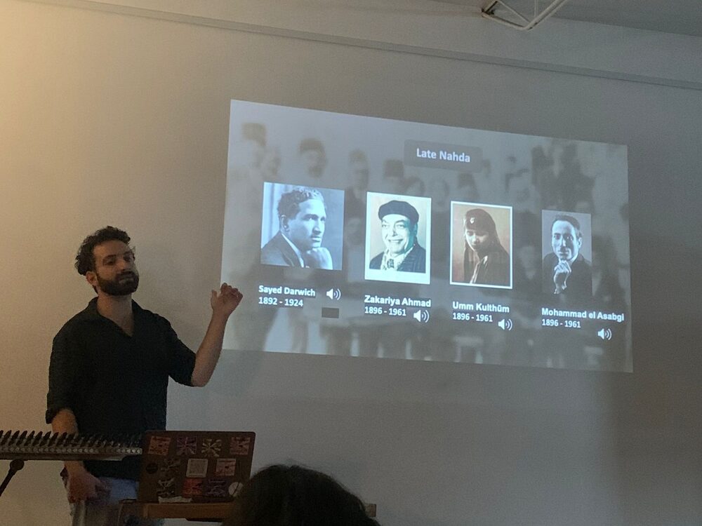 Camille presenting an Arabic music history workshop