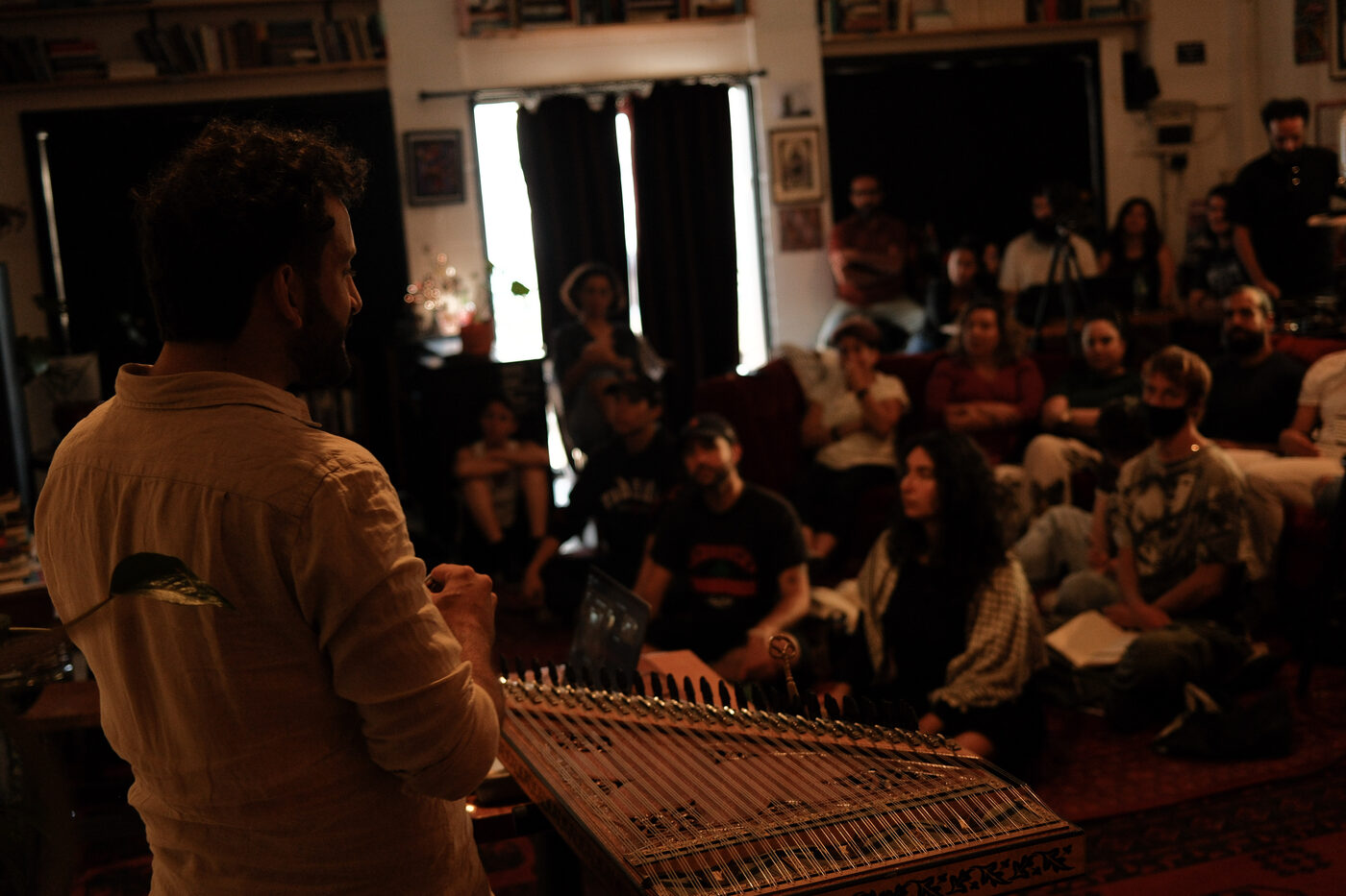 Camille leading a workshop, qanun for an audience